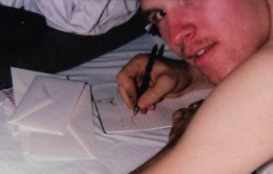 Jim in his rack writing a letter