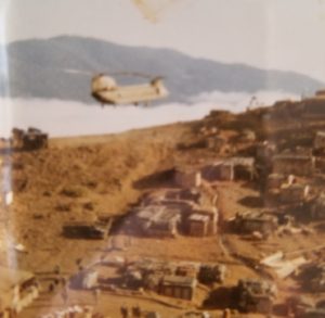 Photo of a helicopter resupplying San Juan Hill in Vietnam.