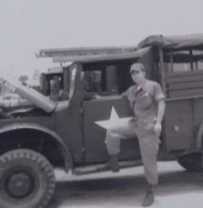 Sergeant Paul Schuler with a truck
