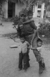 Image of Billy Terrell at Mang Lang Orphanage with Boys in 1966