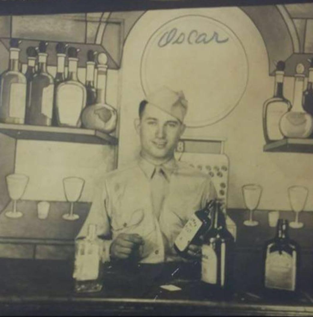 Oscar Green posing on a bar set in 1944