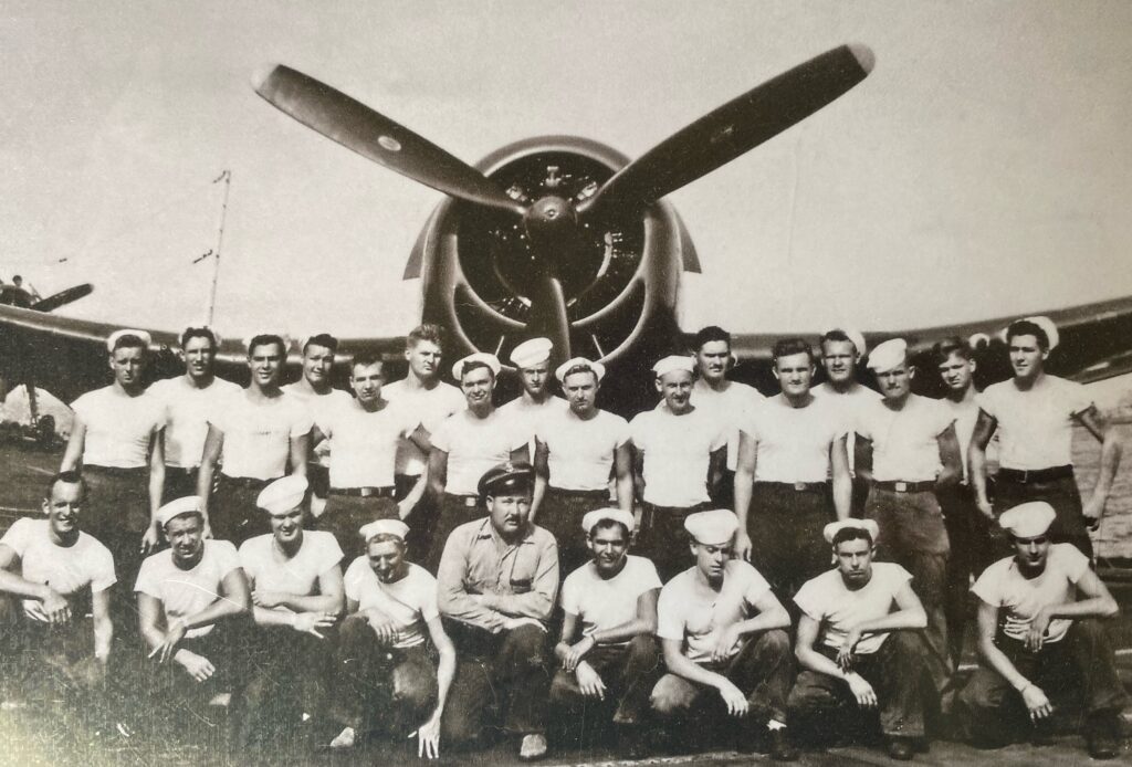 An F6F and its support team aboard USS San Jacinto (CVL-30)