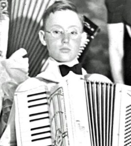Boy playing the accordion.
