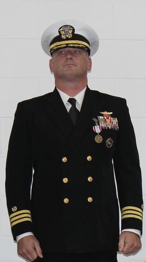 Navy officer in dress blue uniform