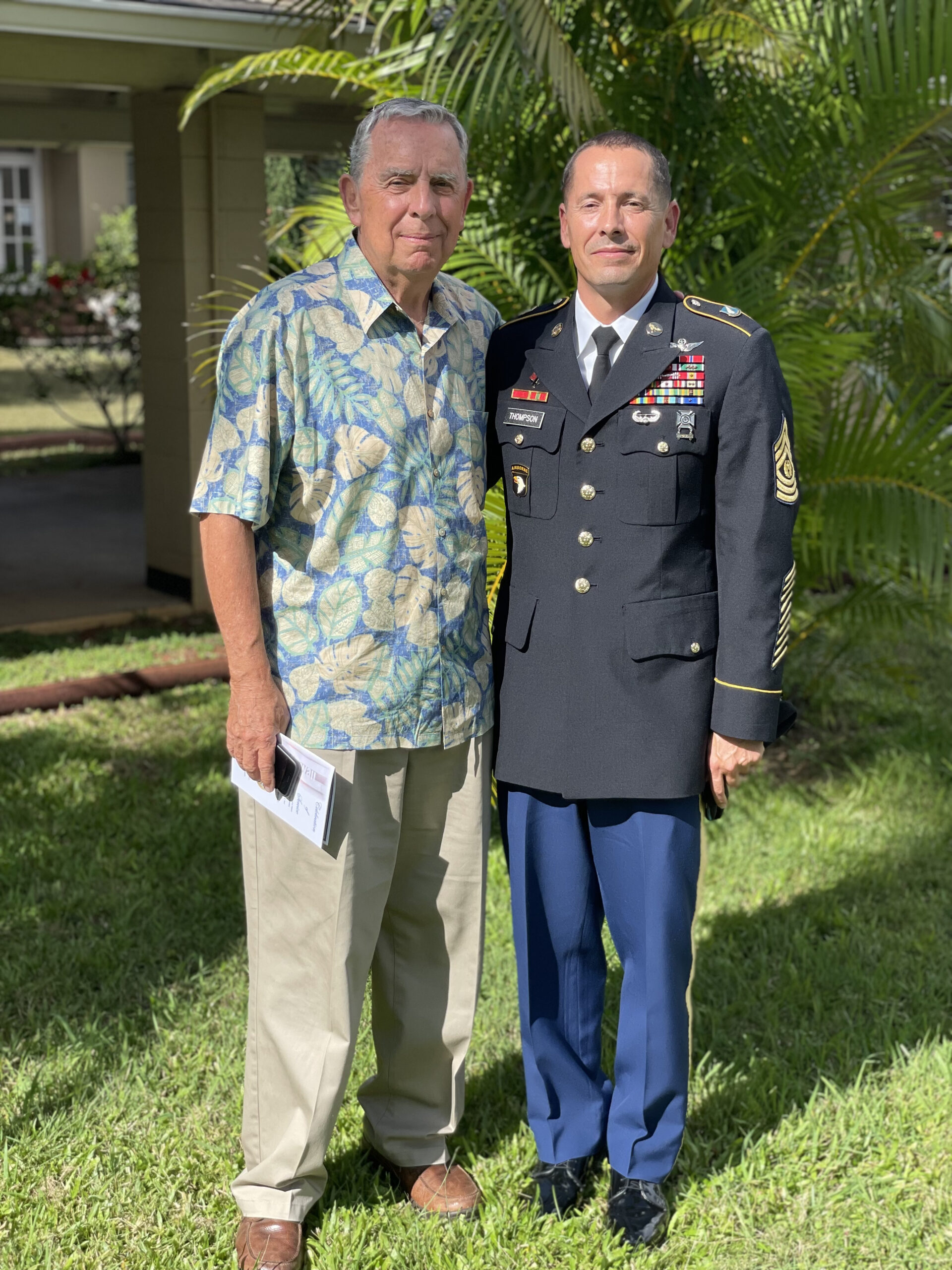Father standing with his son who is in an Army uniform