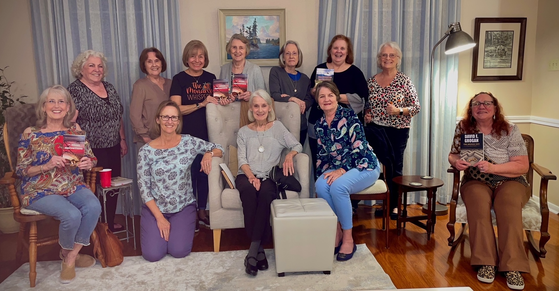 Women in book club holding books by David E. Grogan