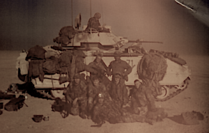 U.S. Army soldiers in front of a Bradley Fighting Vehicle.