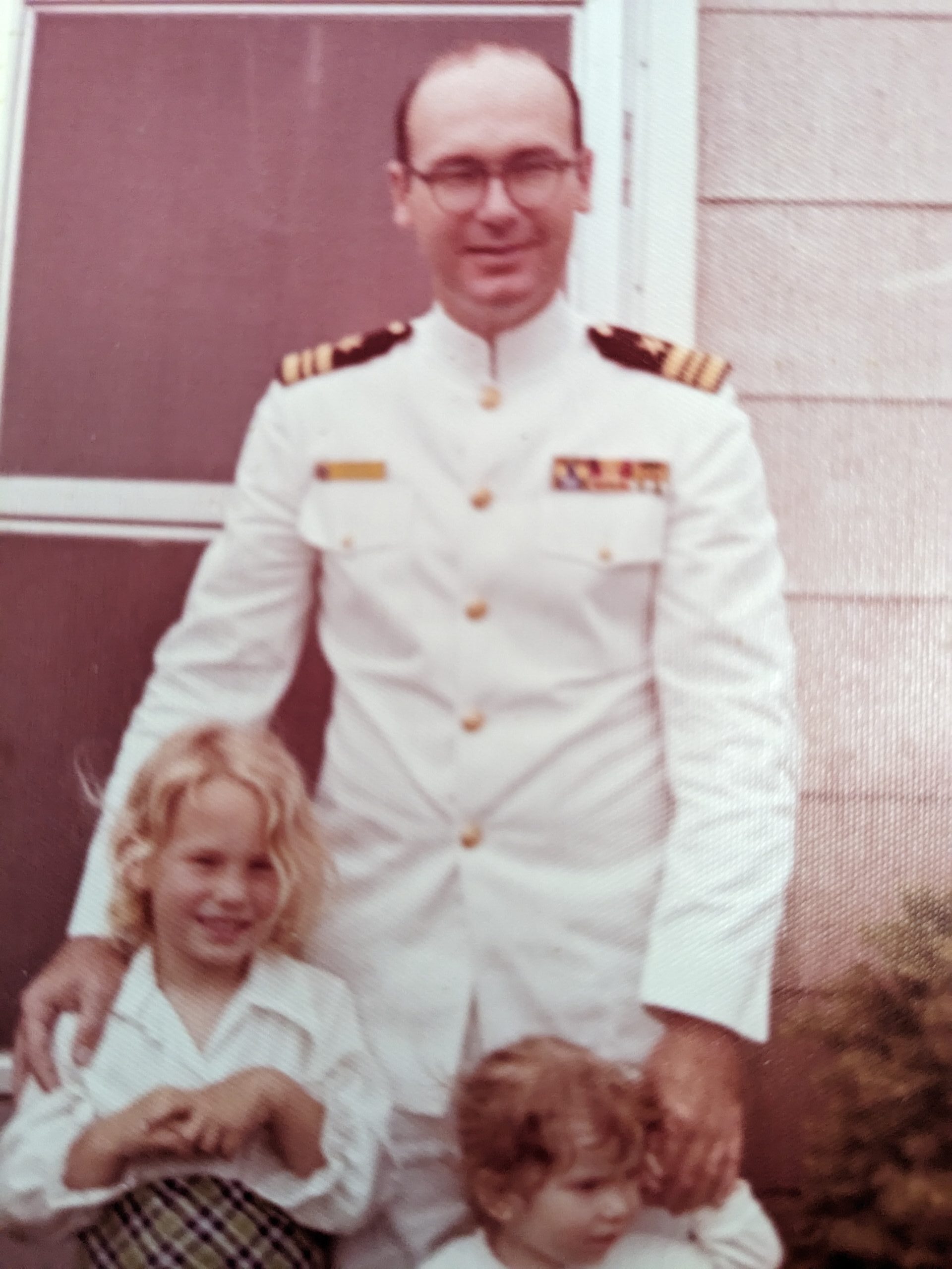 A Navy officer with two children