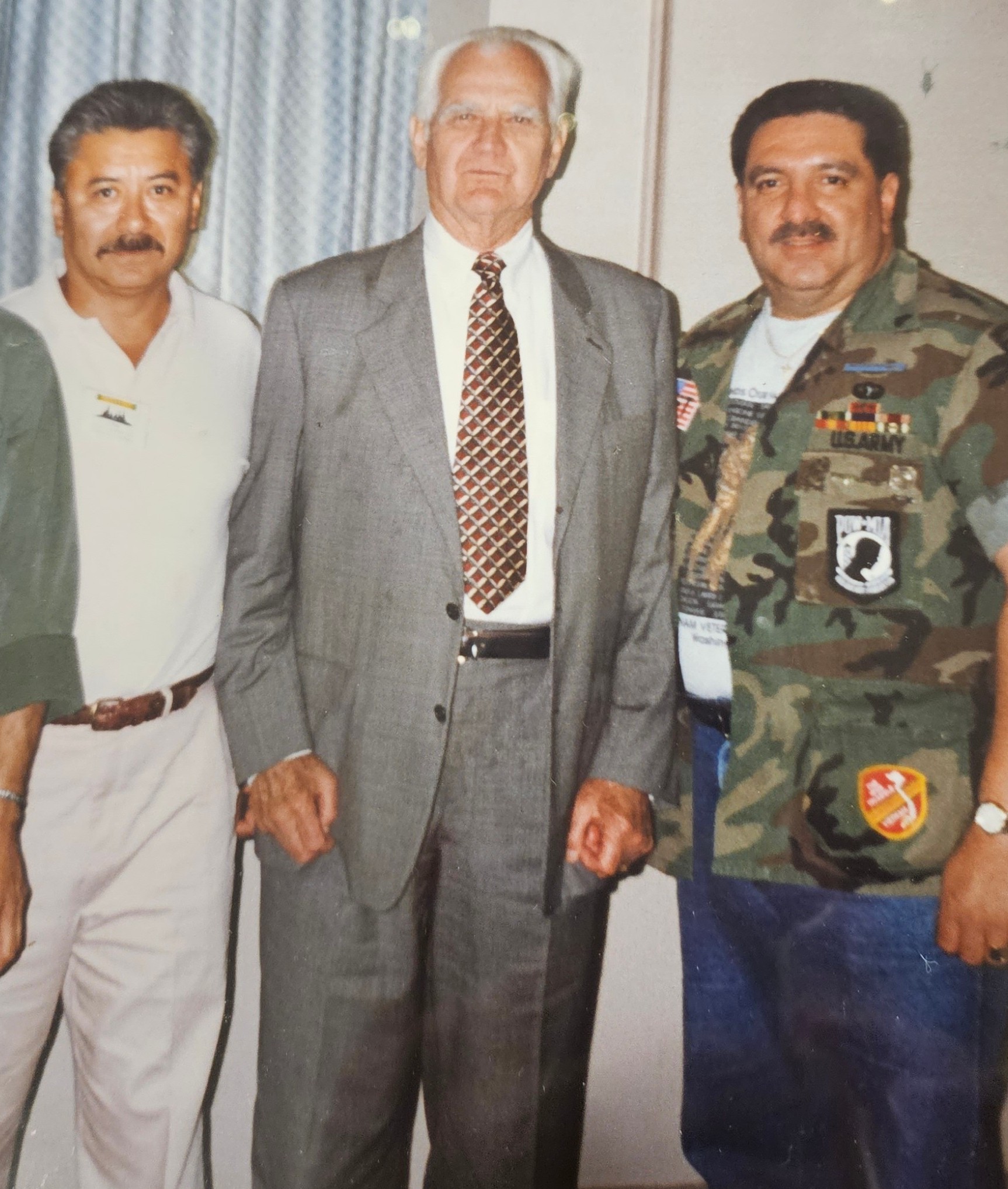 Two Vietnam veterans standing with General William C. Westmoreland