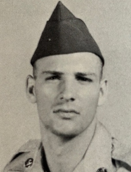 Headshot of soldier wearing his hat