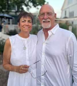 Husband and wife both wearing white shirts