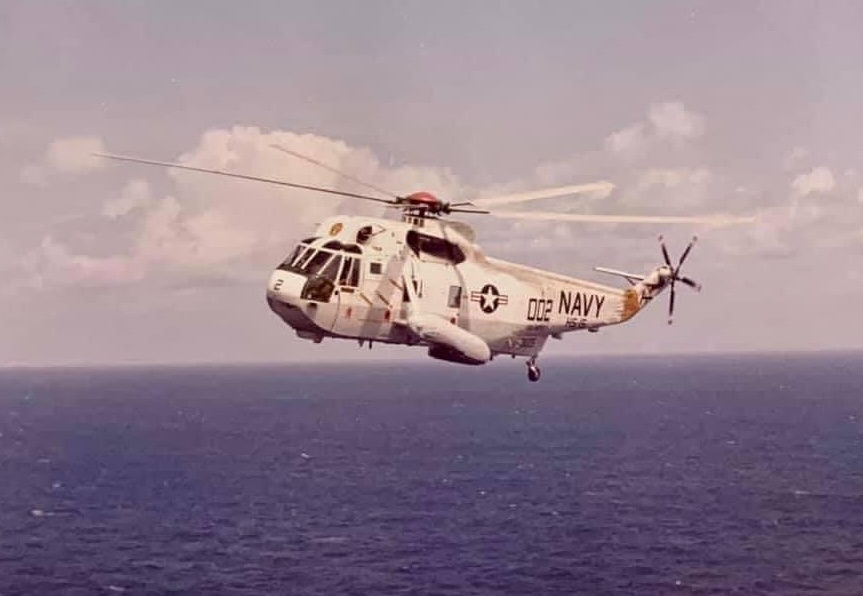 SH-3 Sea King helicopter flying over water
