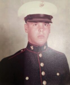 A male U.S. Marine's portrait in uniform at boot camp.