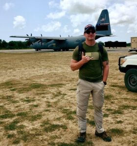 Man standing with C-130 in background