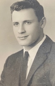 A young man wearing a sport coat and tie in the early 1960s
