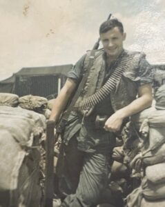 A U.S. soldier in Vietnam with an band of ammunition slung over his shoulder