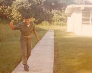 U.S. Marine in utility uniform walking on a sidewalk