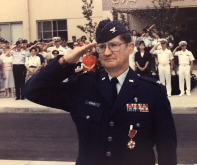 Chaplain, Colonel, Marion Reynolds, U.S. Air Force (Retired), saluting at his retirement ceremony