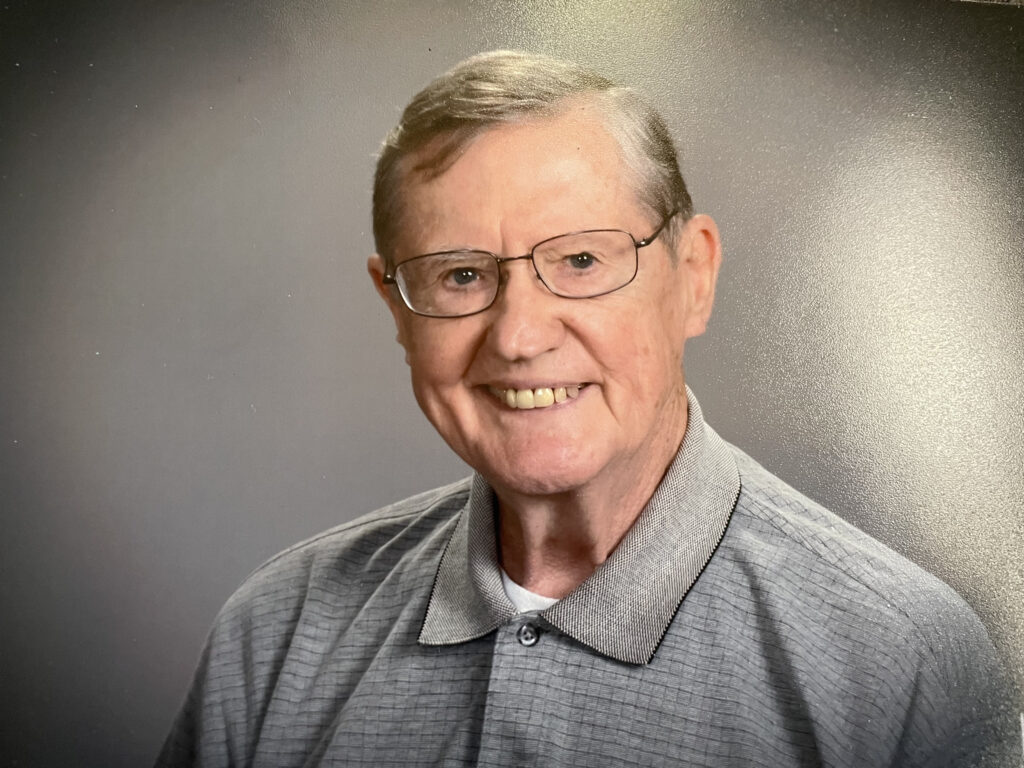 Man wearing glasses and smiling