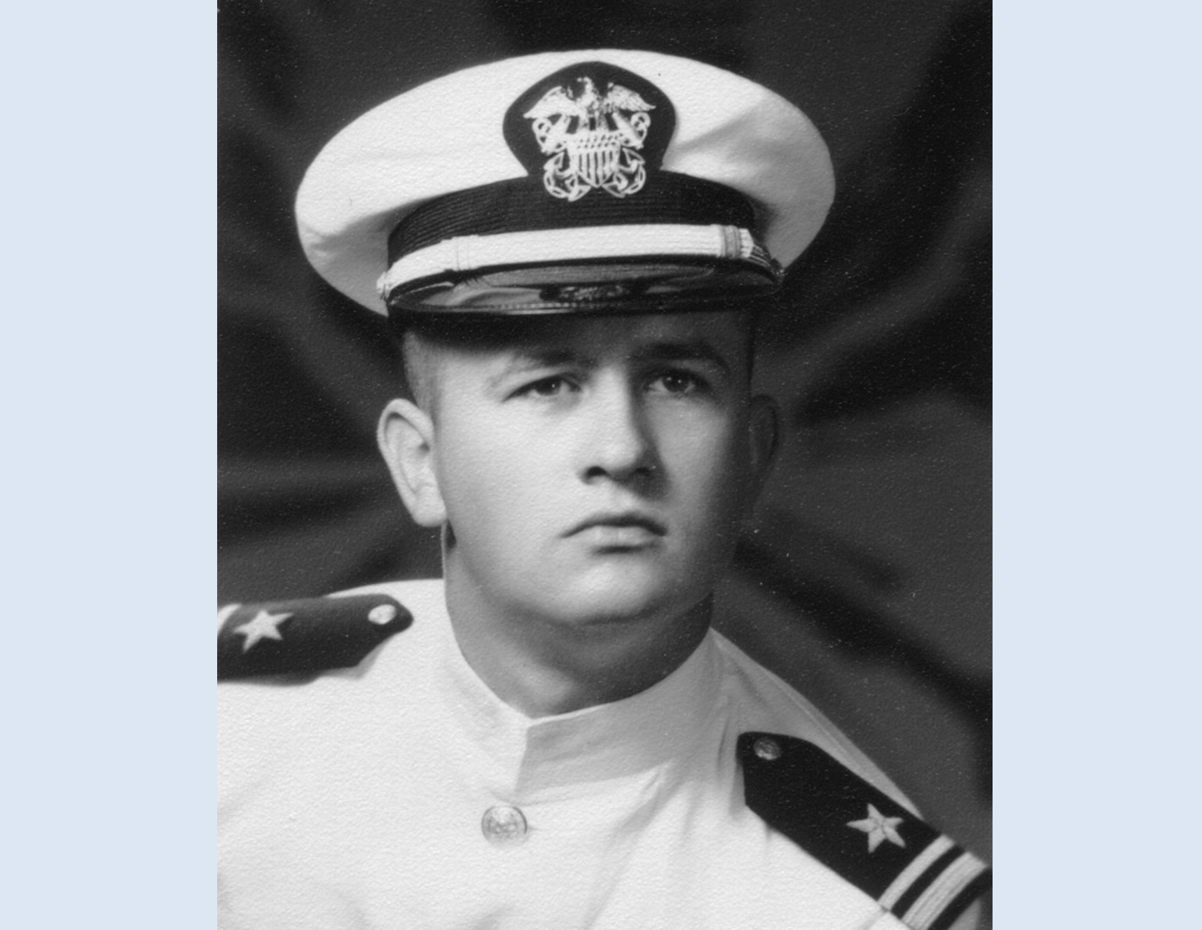 Head shot of Male Navy LTjg in Choker White Uniform