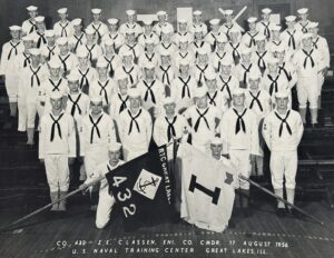 Navy Boot Camp graduation photo with a group of sailors in formation graduating on 17 August 1956.