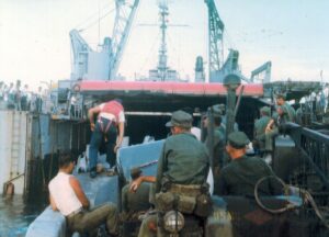 Marines in a landing craft returning to the well deck of their amphibious ship