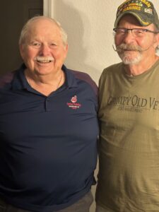 Two Marine Corps veterans standing side-by-side